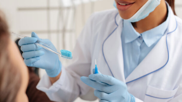 Cropped View Of Dentist In Latex